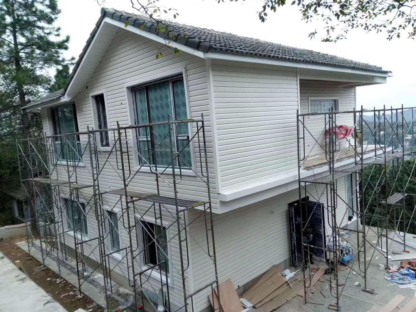 江苏PVC外墙挂板仿木纹扣板集装箱木屋钢结构房屋旧房改造外墙板
