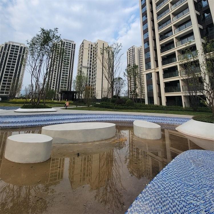 上海真石丽泰科石圆形花坛街道白色泰科石弧形坐凳安装 
