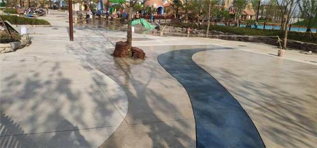 ​湖北砾石聚合物仿石地坪鄂州海昌公园卡通洗砂地坪设计